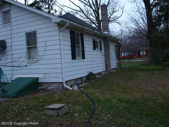 82 Carlton Road Mount Pocono, PA 18344 - Photo 3 of 8 a view of a brick house with a yard