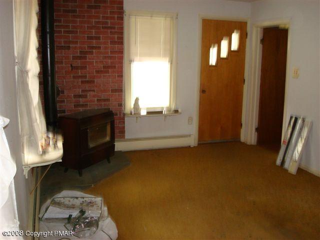 82 Carlton Road Mount Pocono, PA 18344 - Photo 4 of 8 a view of livingroom with furniture and a fireplace