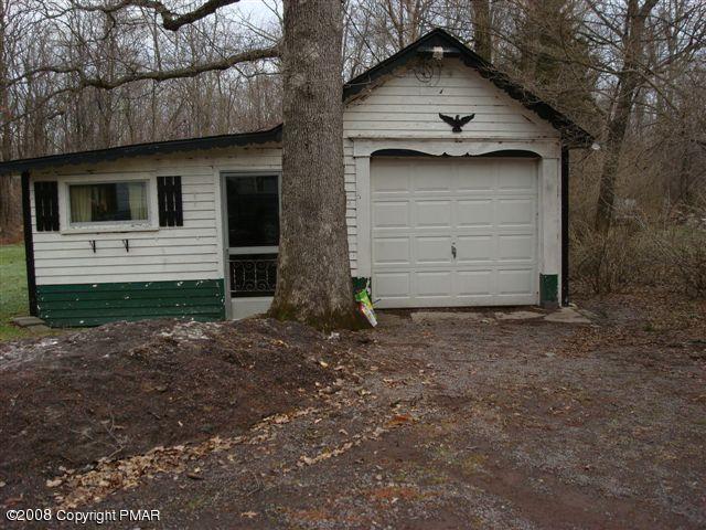 82 Carlton Road Mount Pocono, PA 18344 - Photo 6 of 8 a house with a yard