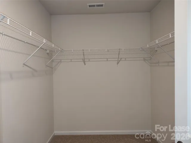 a view of a room with racks on the wall