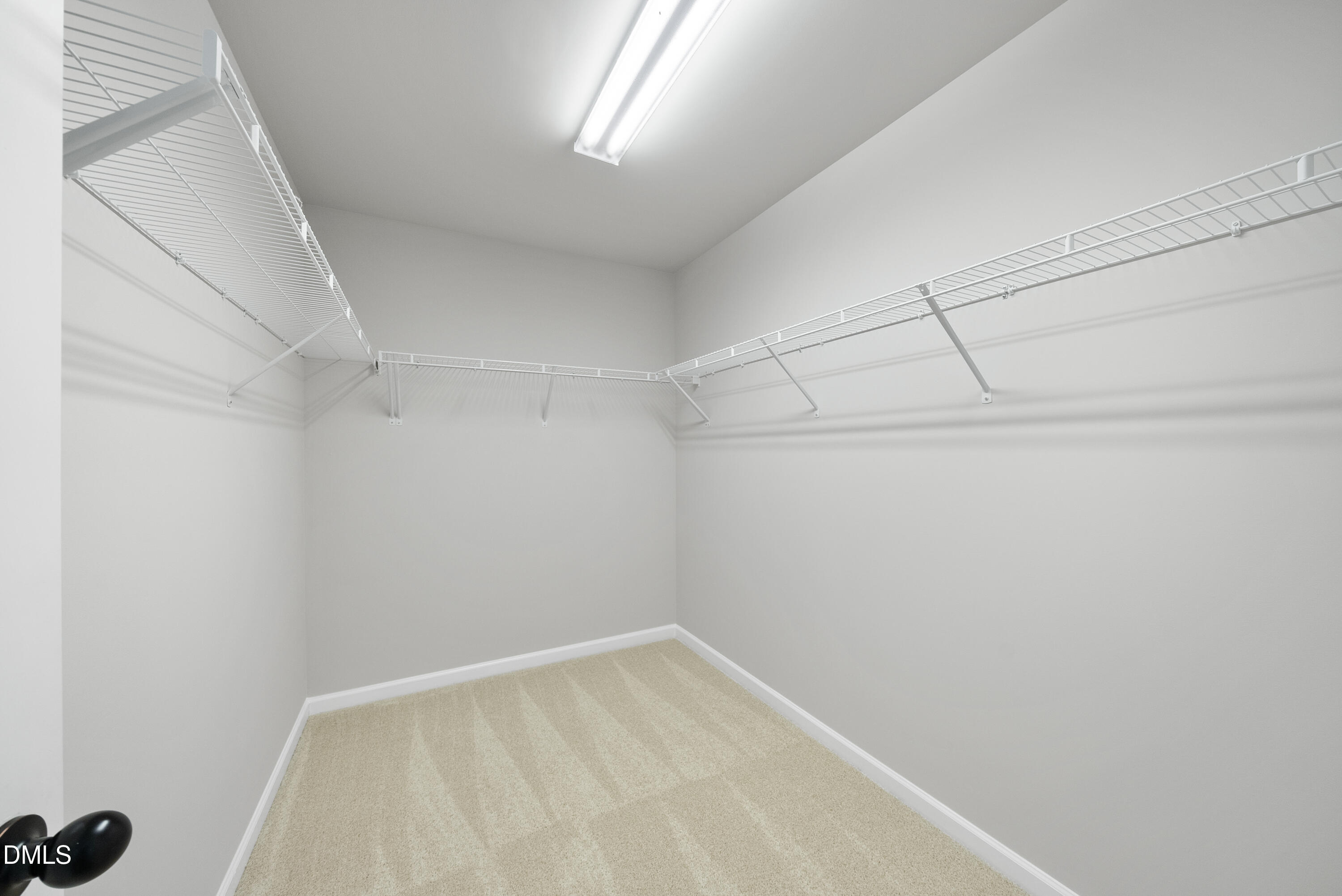 2816 Elsa Drive Raleigh, NC 27610 - Photo 28 of 35 a view of a room with racks on the wall