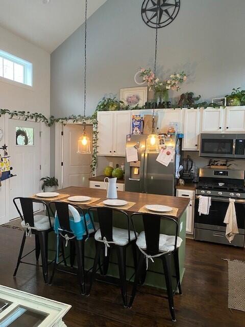 943 Youngblood Road Edgefield, SC 29824 - Photo 3 of 18 a kitchen with a dining table chairs and wooden floor