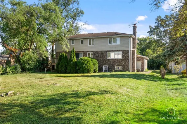a view of a big yard next to a house