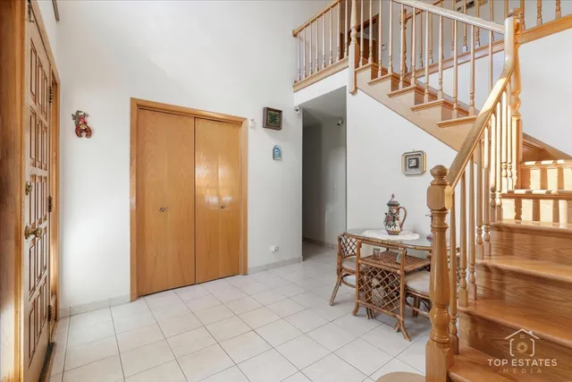 a view of a livingroom with furniture and staircase
