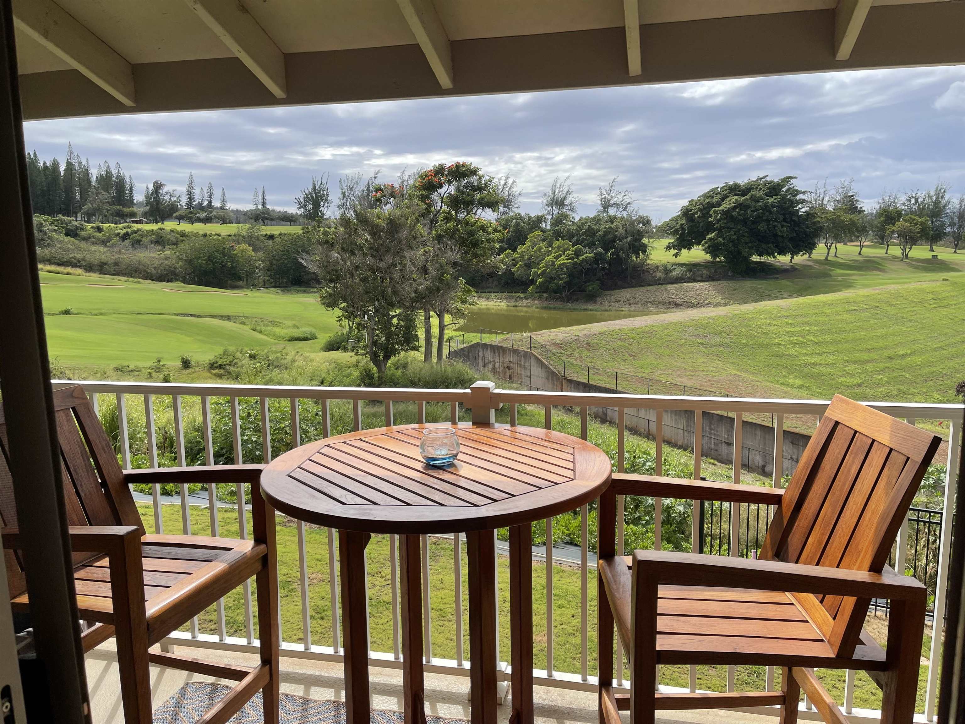 5510 Lower Honoapiilani Road, Unit C22 Lahaina, HI 96761 - Photo 5 of 13 a view of a chairs and table in patio of the house