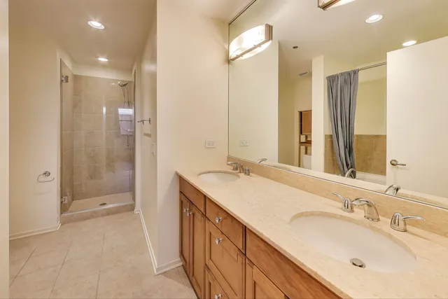 a bathroom with a sink double vanity and a mirror