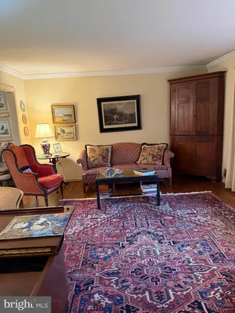 a living room with furniture and a rug