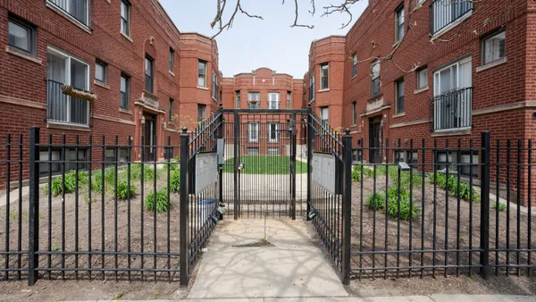 a view of a brick building from a balcony