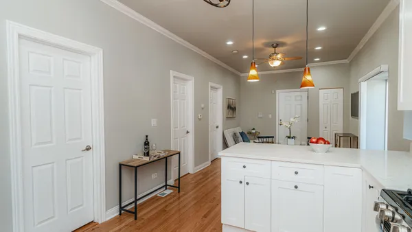 a bedroom with a bed and a lamp