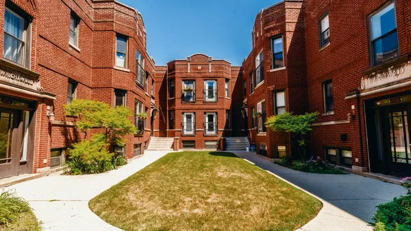 a view of a building with a garden