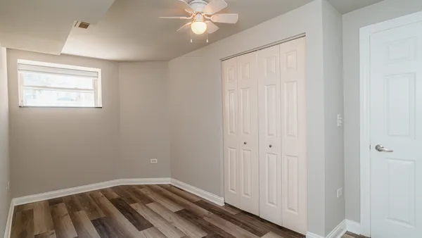 a view of a room with wooden floor
