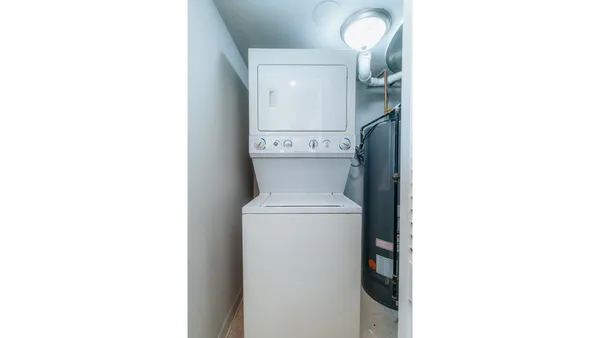 a view of a hallway with furniture and entryway