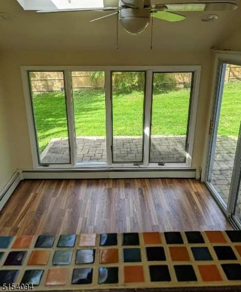 33 Roseland Avenue Warren, NJ 07059 - Photo 3 of 4 a black and white checkered floor with a view of a backyard