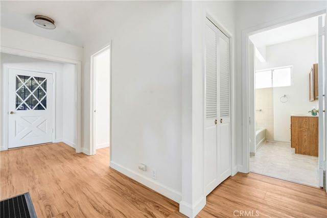 a view of an empty room and wooden floor