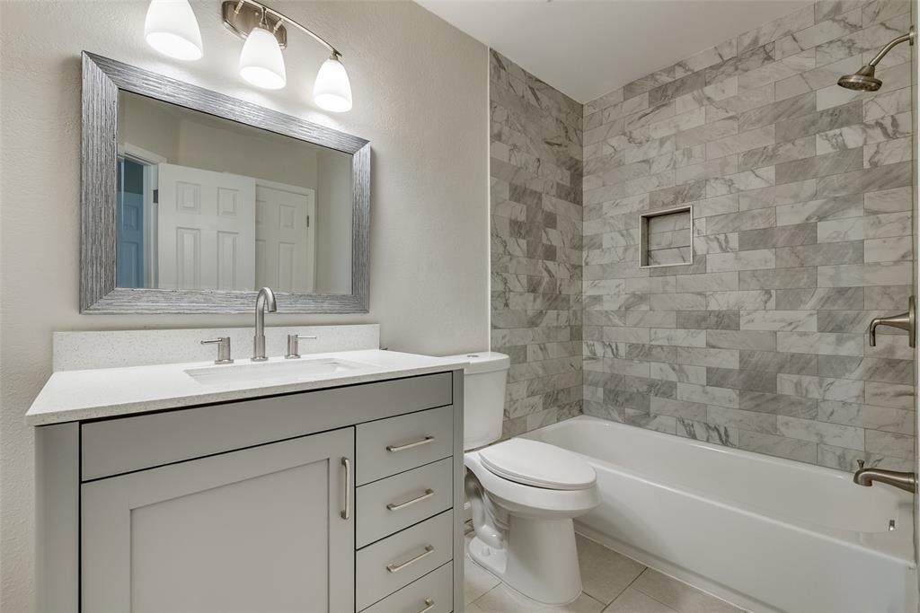 709 Lee Street, Unit 3 Mesquite, TX 75149 - Photo 6 of 9 a bathroom with a sink a toilet and shower