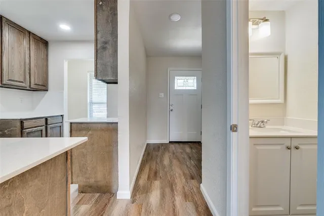 a view of a kitchen from the hallway