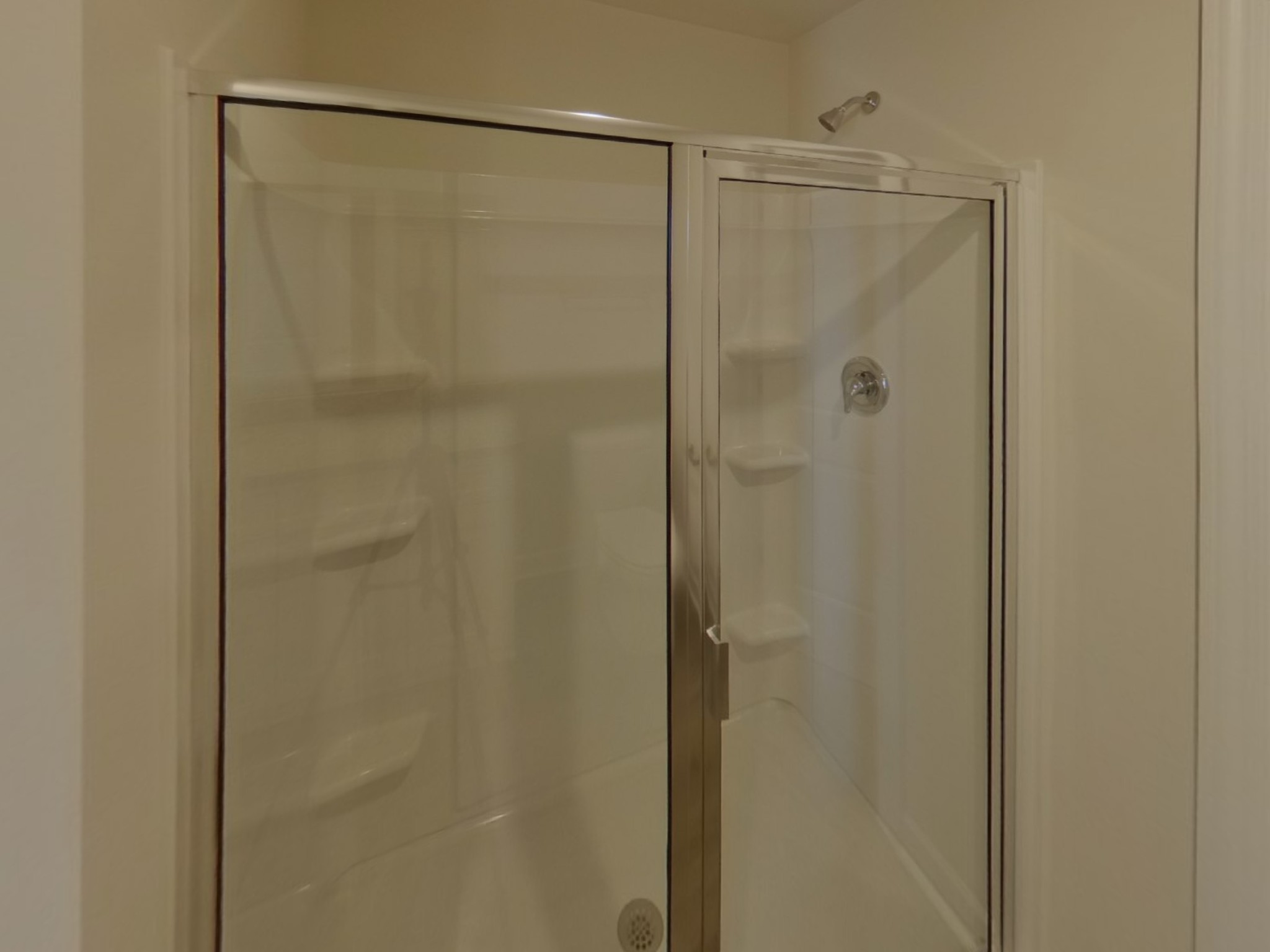 2404 Nabali Way Murfreesboro, TN 37127 - Photo 7 of 15 a bathroom with a glass shower door