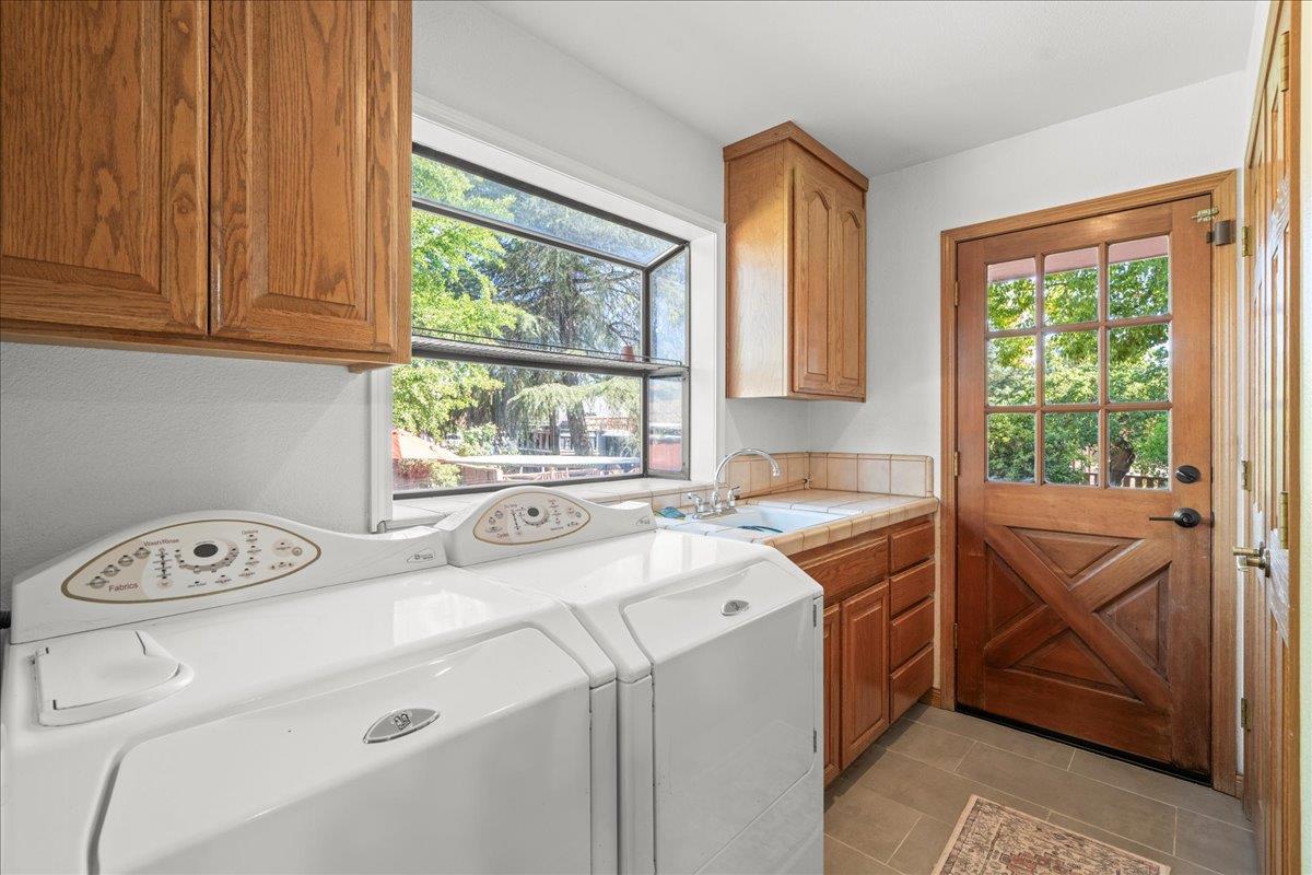 14325 Monterey Road Morgan Hill, CA 95037 - Photo 21 of 41 a utility room with dryer and washer