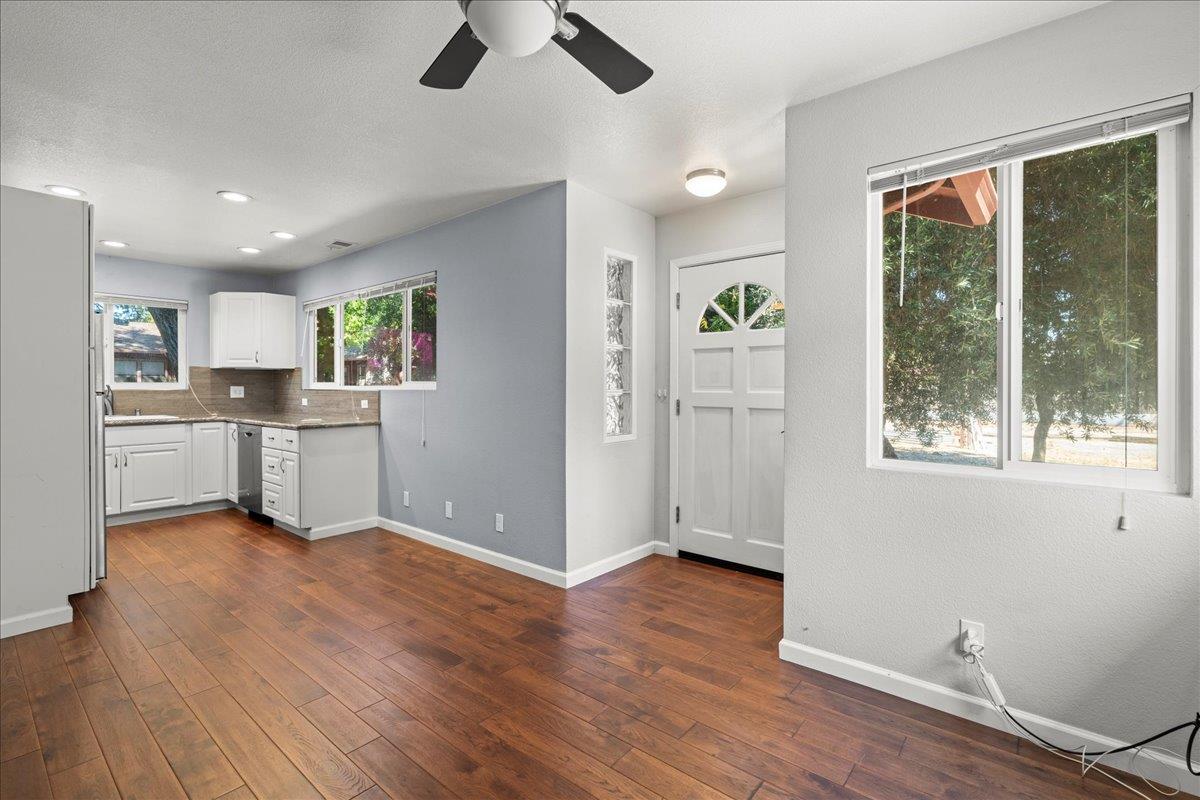 14325 Monterey Road Morgan Hill, CA 95037 - Photo 26 of 41 a view of a kitchen with wooden floor electronic appliances and windows