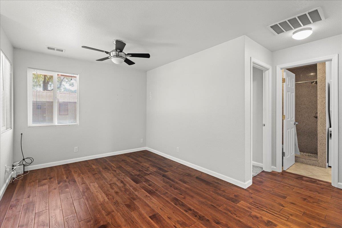 14325 Monterey Road Morgan Hill, CA 95037 - Photo 27 of 41 wooden floor in an empty room with a window