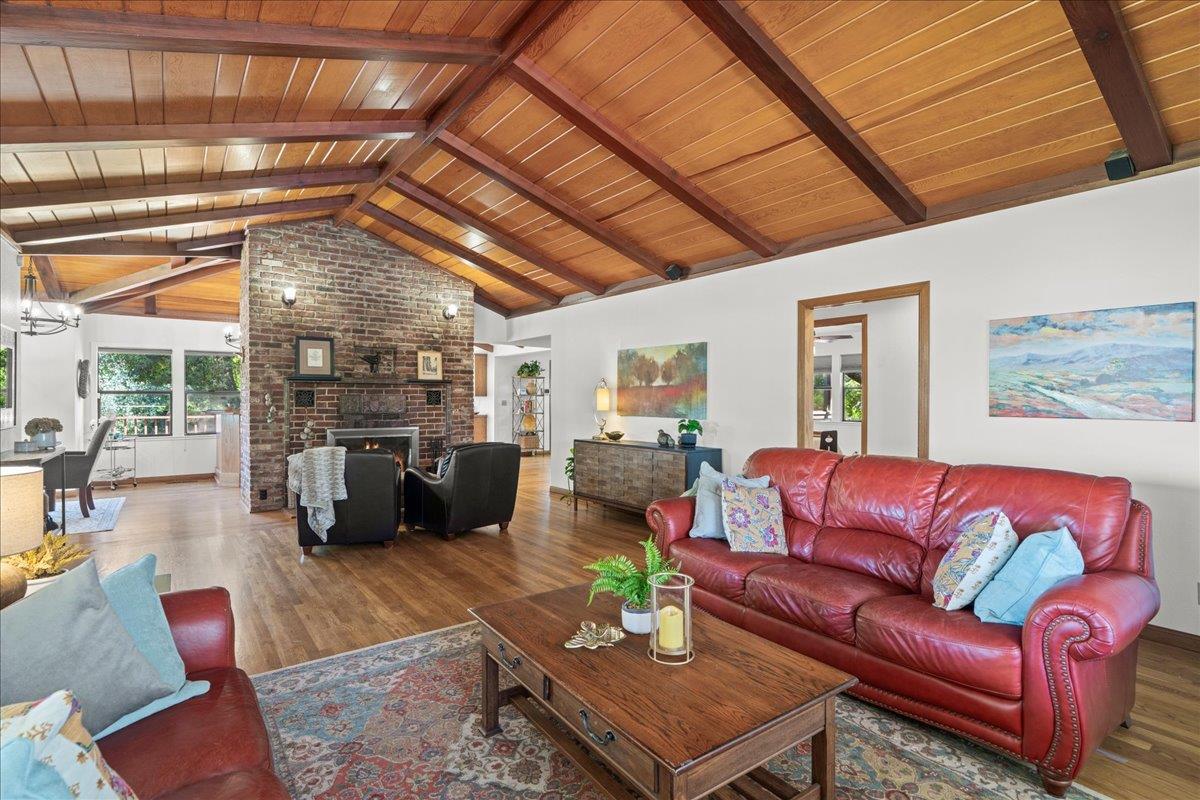 14325 Monterey Road Morgan Hill, CA 95037 - Photo 7 of 41 a living room with furniture a flat screen tv and next to a window