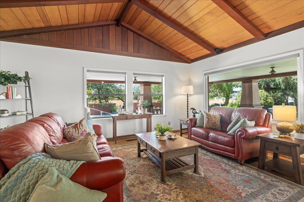 14325 Monterey Road Morgan Hill, CA 95037 - Photo 10 of 41 a living room with furniture a rug potted plant and a large window