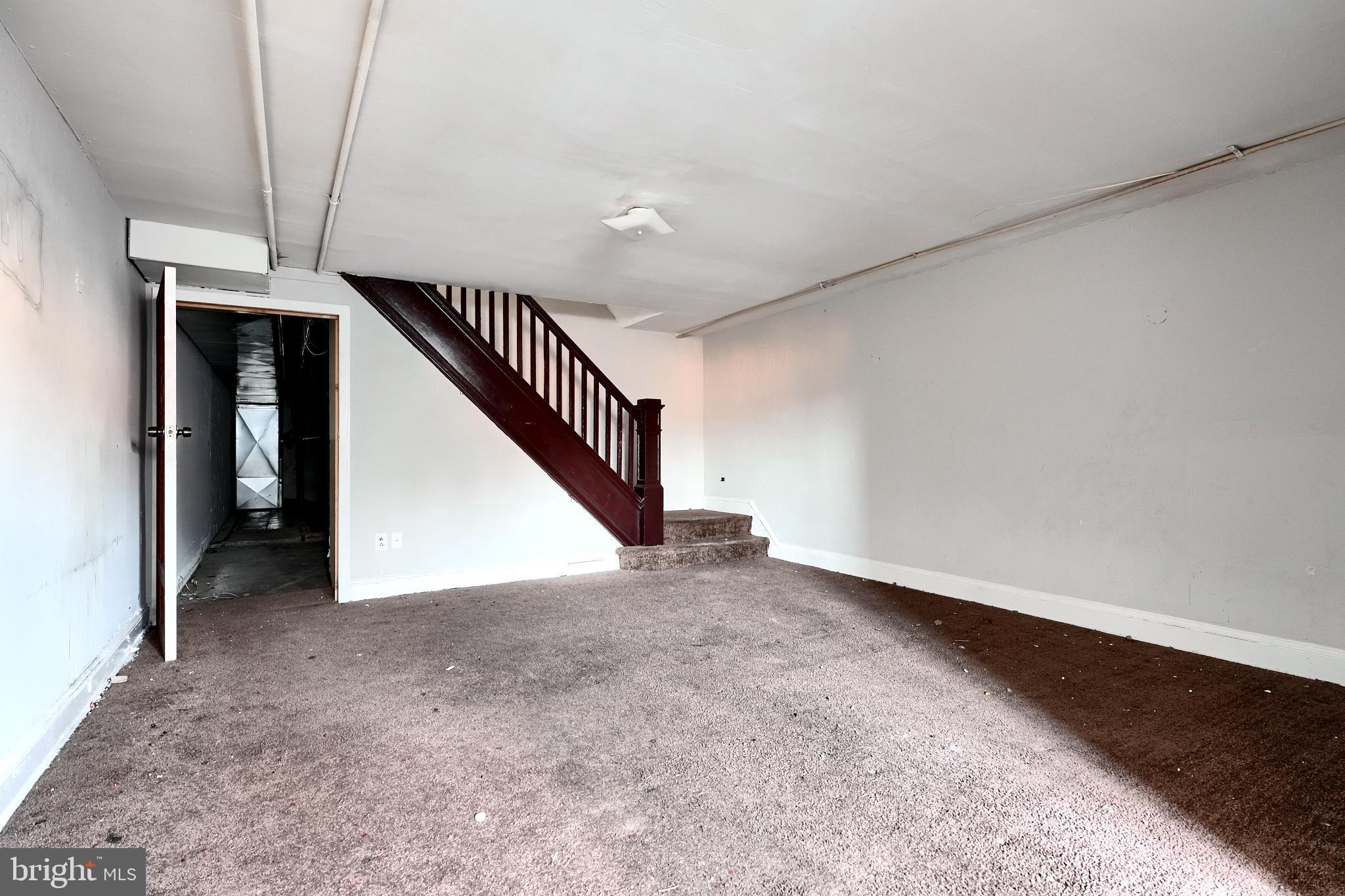 5106 Harford Road Baltimore, MD 21214 - Photo 23 of 23 a view of an empty room with stairs