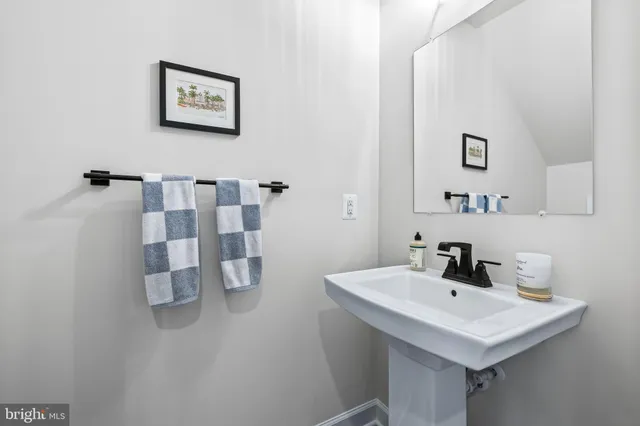 a bedroom with furniture and a large window