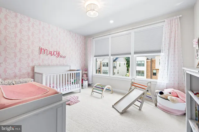 a living room with furniture cabinets and window