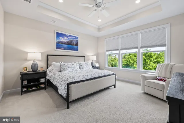 a view of walk in closet with clothes