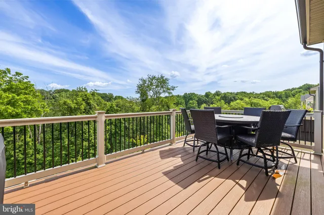 a view of a roof deck with furniture
