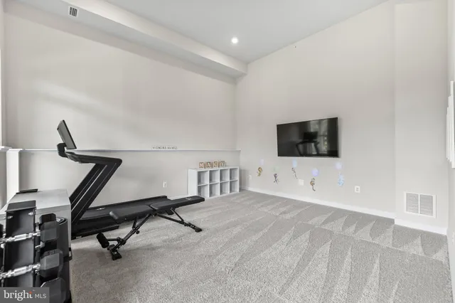 a view of a room with furniture and windows