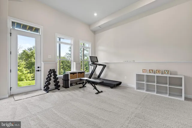 a view of a livingroom with workspace and a couch