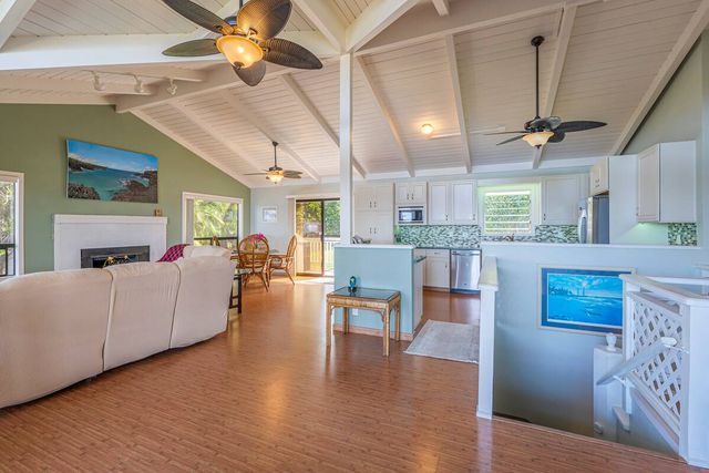 a kitchen with stove and refrigerator