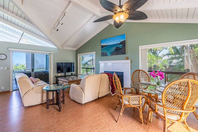 a kitchen with stainless steel appliances granite countertop a stove and cabinets with wooden floor