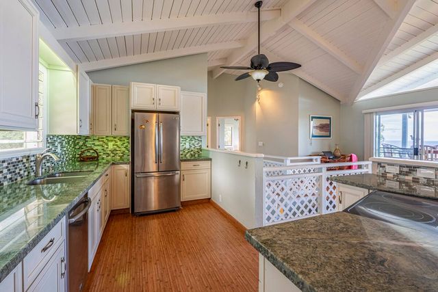 a kitchen with appliances cabinets and a sink