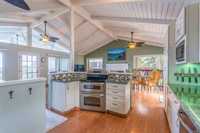 a view of kitchen with furniture and wooden floor