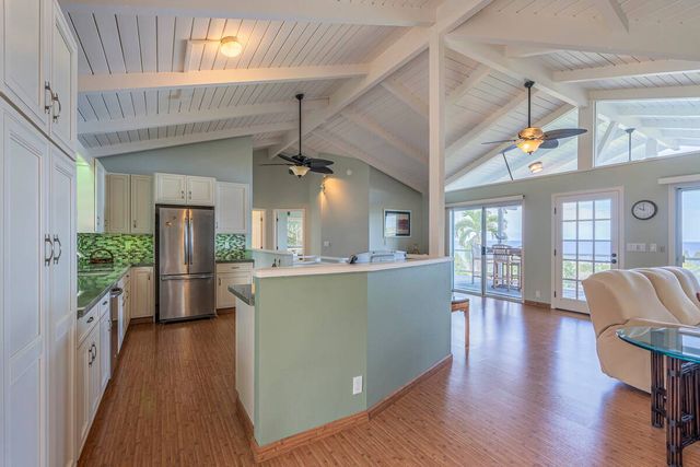 a bedroom with a bed mirror and window