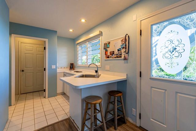 a bathroom with a toilet a sink and a mirror