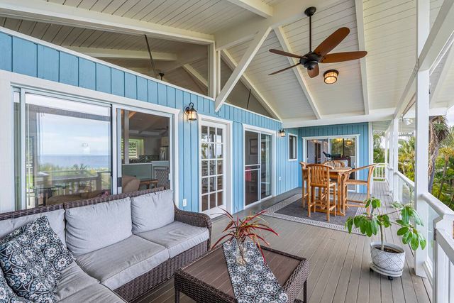 a living room with furniture or kitchen and a wooden floor