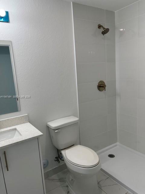25822 Southwest 144th Court, Unit 25822 Homestead, FL 33032 - Photo 12 of 19 a white toilet sitting next to a bathroom sink