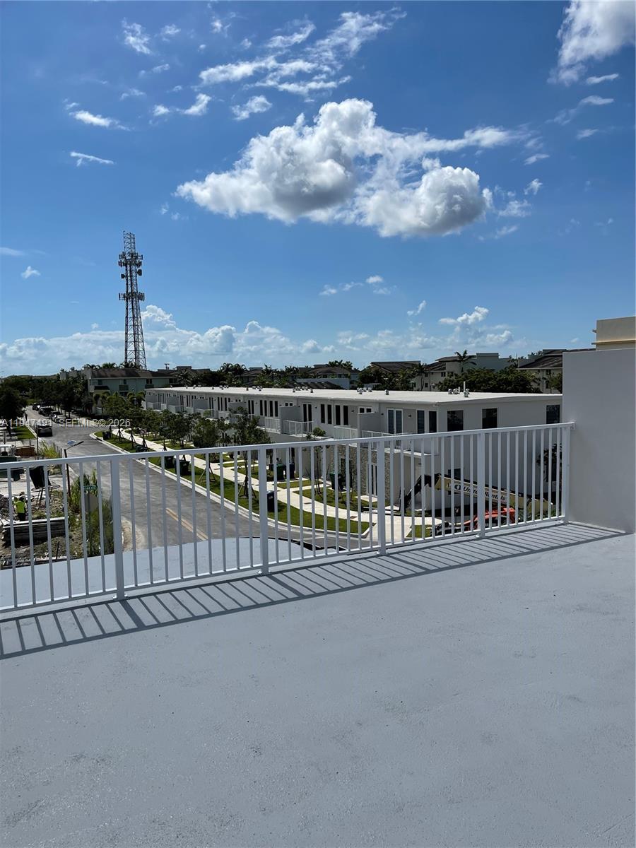 25822 Southwest 144th Court, Unit 25822 Homestead, FL 33032 - Photo 17 of 19 a view of balcony with city view