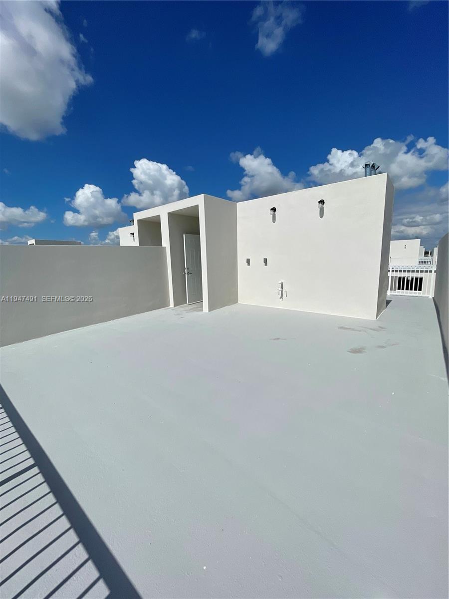 25822 Southwest 144th Court, Unit 25822 Homestead, FL 33032 - Photo 19 of 19 a view of a room with a garage