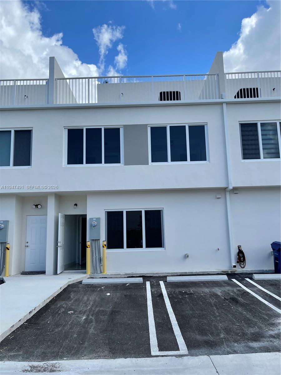 25822 Southwest 144th Court, Unit 25822 Homestead, FL 33032 - Photo 3 of 19 a front view of a building