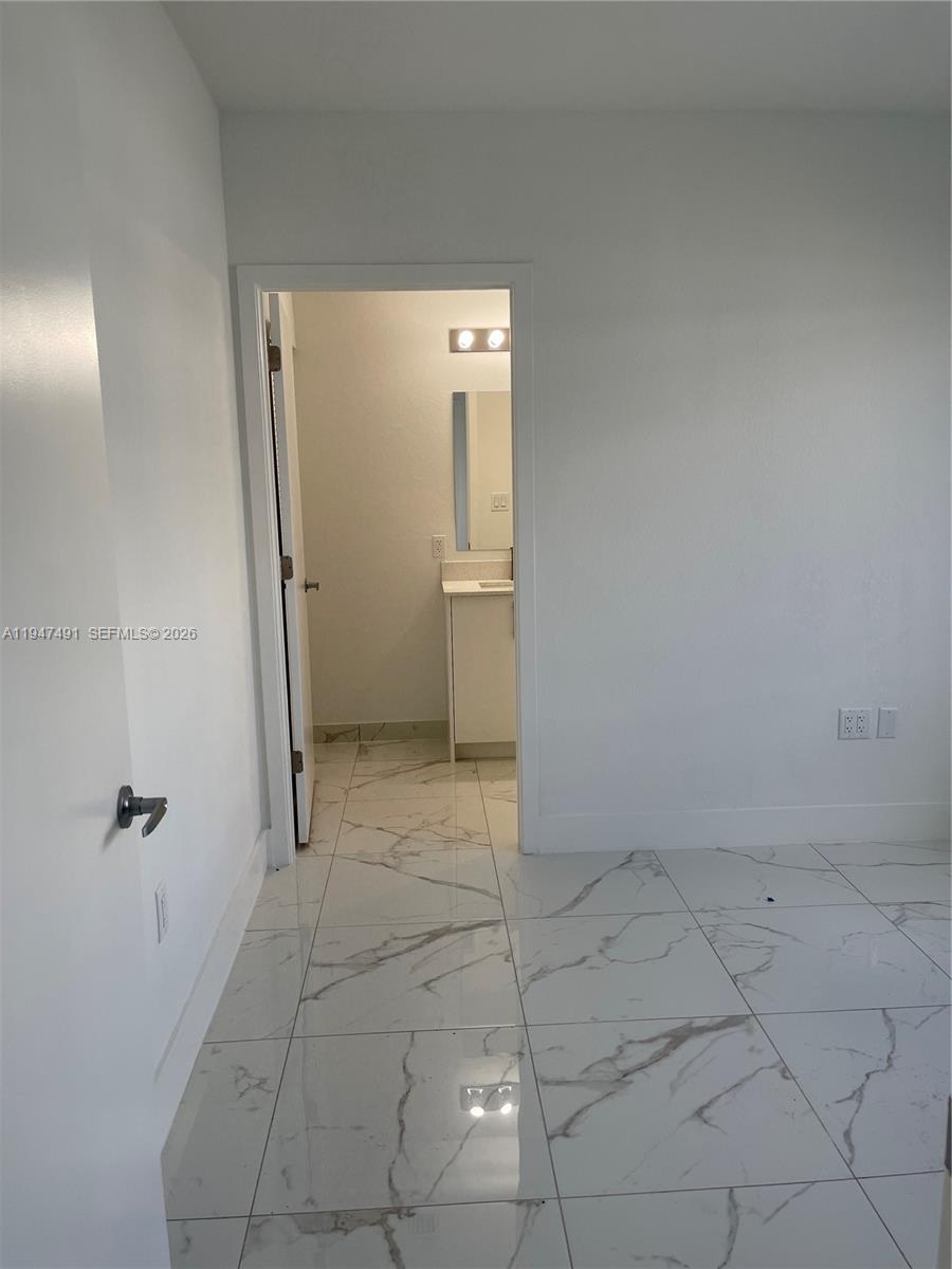 25822 Southwest 144th Court, Unit 25822 Homestead, FL 33032 - Photo 9 of 19 a view of an empty room