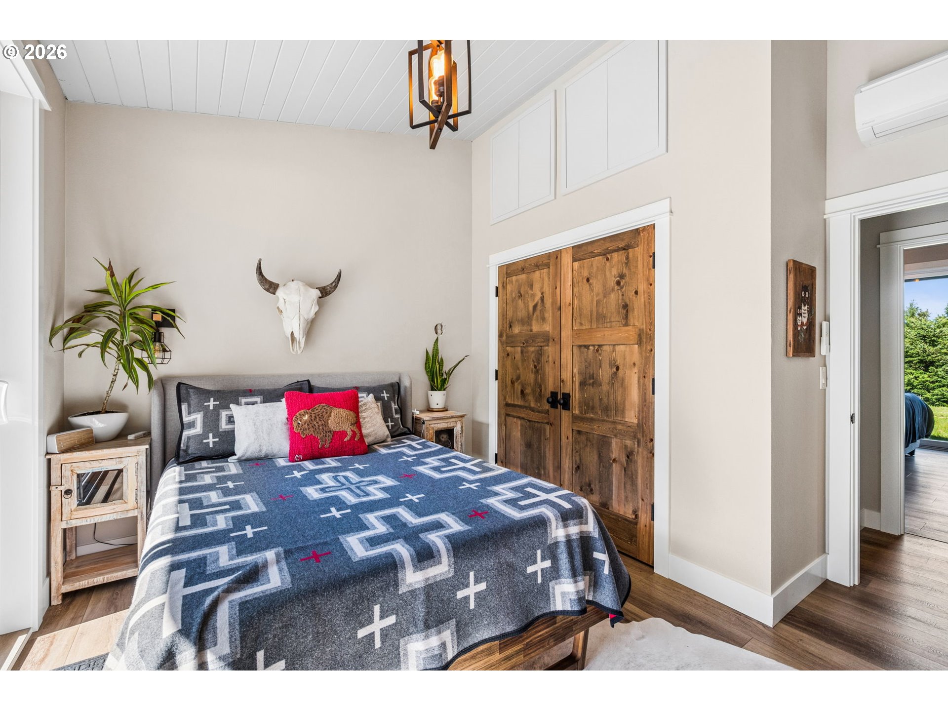 18600 Northwest Meadowlake Road Yamhill, OR 97148 - Photo 26 of 47 a bedroom with a bed and a potted plant