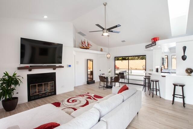 a living room with fireplace furniture and a flat screen tv