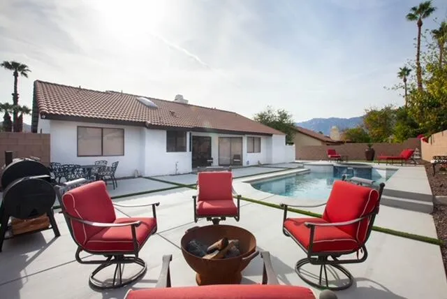 a outdoor living space with furniture and city view