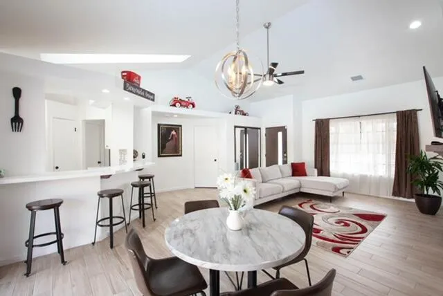a view of a dining room with furniture window and wooden floor