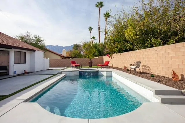 a view of a swimming pool with a patio